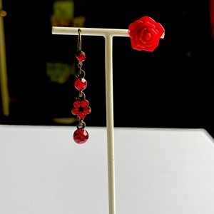 Asymmetric pair of red earrings